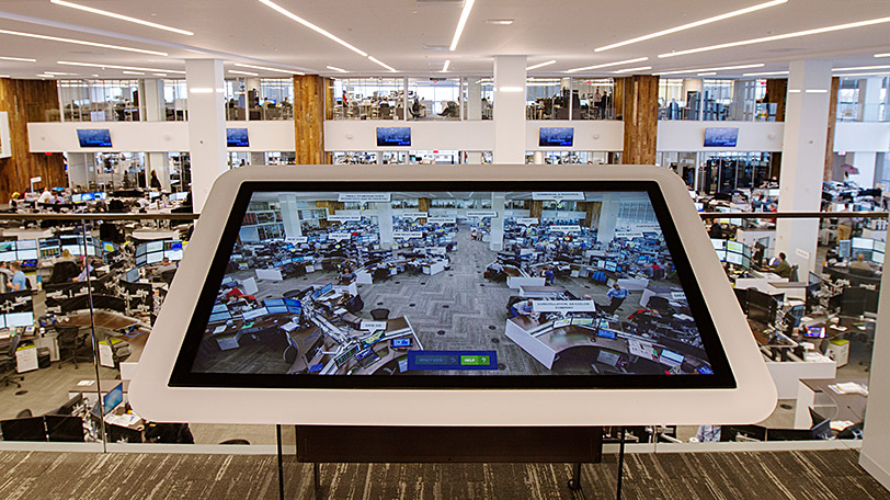 Large-format touchscreen lets visitors interactively explore the energy trading floor.